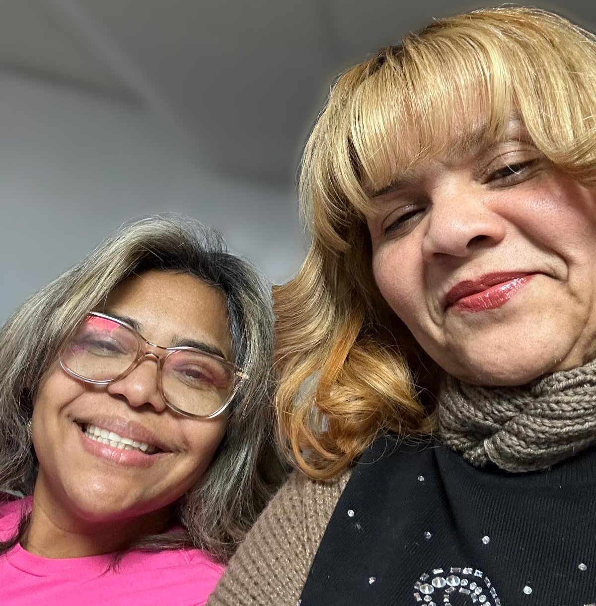 The two sisters who own La Bella Hair Salon, smiling together